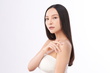 A beautiful young Asian woman with clean, fresh skin against a white background. Skincare, facial...