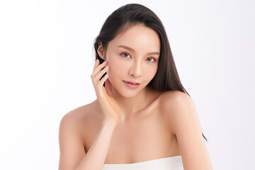 A beautiful young Asian woman with clean, fresh skin against a white background. Skincare, facial...