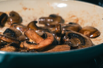 Sautéed Brown Mushrooms in a Blue Pan