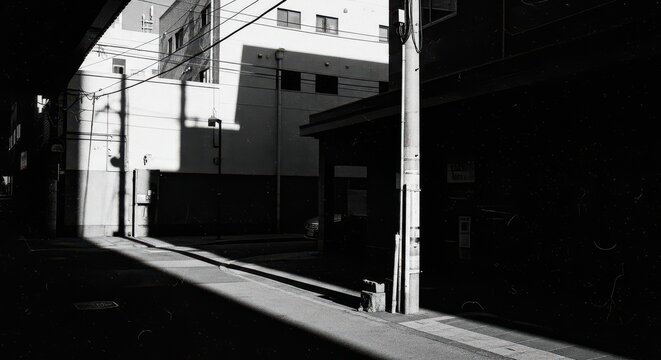 Fototapeta Sunlit Alleyway In Japan Black And White Photography