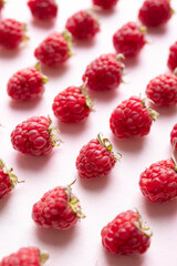 Fresh ripe raspberry with leaf on pink background, Summer fruit