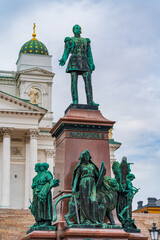 Obraz premium Statue of Alexander II, a monument at the Senate Square in front of the Helsinki Cathedral in Helsinki, Finland