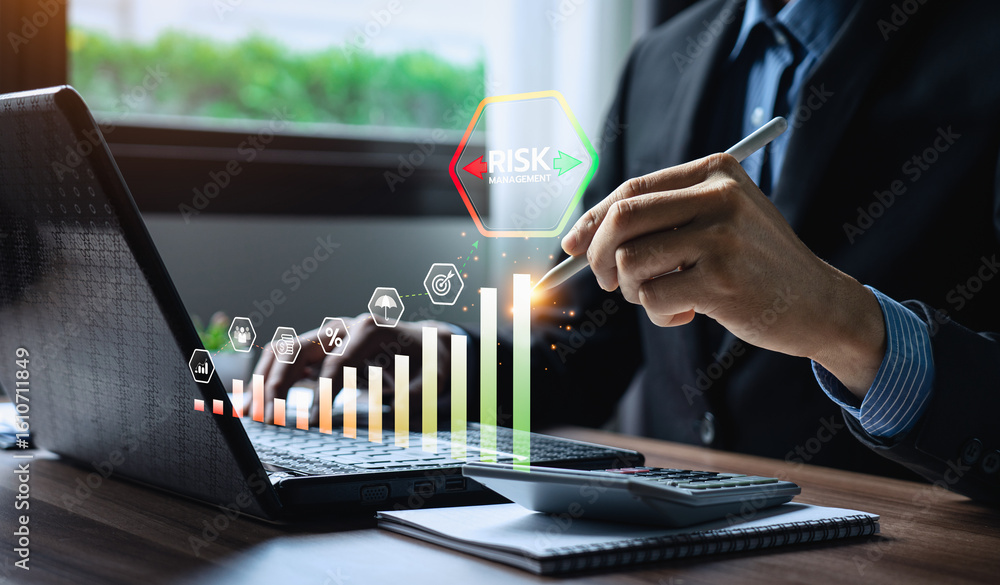 Poster businessman using digital pen on laptop with visualized bar chart and icons representing financial r