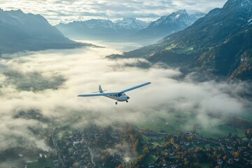 Fototapeta premium Flying above misty valleys of Switzerland with mountains in the distance during early morning, Flying through mist over Switzerland valley and mountains