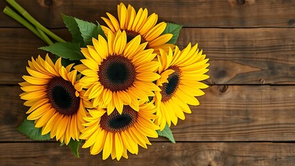 Golden sunflowers arranged on a rustic wooden surface, glowing warmly under soft overhead lighting.