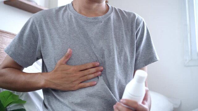 Man Taking Antacid Gel to Relieve GERD, Acid Reflux, and Stomach Discomfort Seeking Relief from Painful Digestive Issues and Persistent Heartburn Symptoms