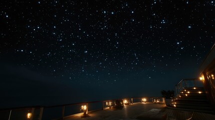 A tranquil night sky above a ship, filled with countless twinkling stars scattered across the deep navy blue expanse