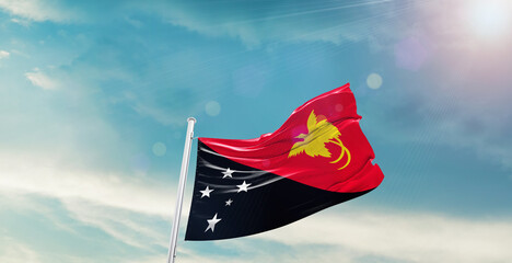Papua New Guinea national flag waving with beautiful sky.
