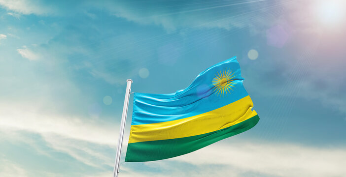 Rwanda national flag waving with beautiful sky.