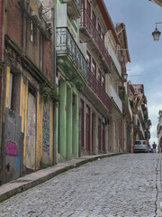 Romantic backstreet, side street or alley in historic old town of Porto Oporto, Portugal with...