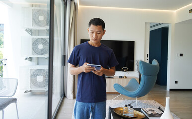 Worker with tablet computer checking air condition system