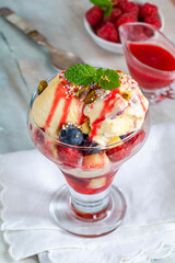 Knickerbocker glory - layered ice cream sundae with fresh fruit