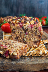 Baked dates and rolled oats loaf with strawberries and walnuts