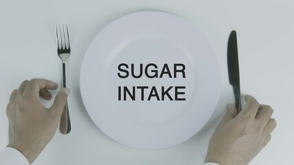 Sugar Intake word on a plate with hands holding fork and knife on white background, symbolizing dietary awareness, nutrition, and healthy eating concept illustration - Powered by Adobe