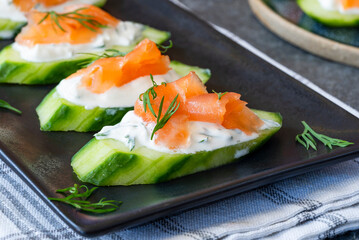 Cucumber and smoked salmon bites with sour cream and dill
