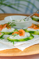 Cucumber and smoked salmon bites with sour cream and dill