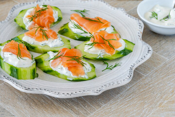 Cucumber and smoked salmon bites with sour cream and dill