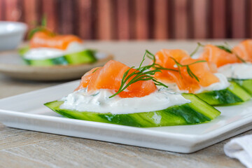 Cucumber and smoked salmon bites with sour cream and dill