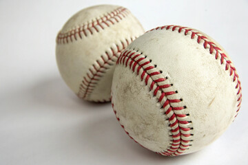 Soft American ball Emblem red Baseball is a bat-and-ball sport played between two teams of nine players each. on white background