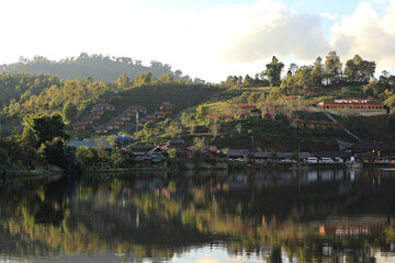 Ban Rak Thai (Mae Aw) Beautiful Tranquil Village in Mae Hong Son Province, Thailand, Rak Thai Village reflection in Richpool at Mae Hong Son, Thailand