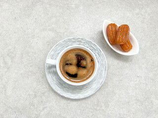 Traditional Turkish Coffee in Porcelain Cup served with Tulumba Dessert