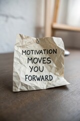 Crumpled Paper with Motivation Quote on a Desk