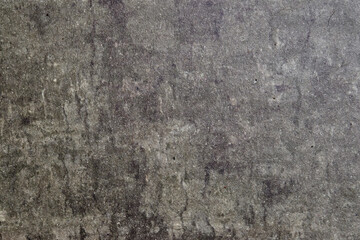 Textured surface resembling natural stone with variations in gray tones and subtle patterns visible under light