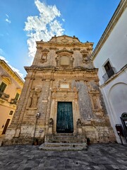 The facade of an old church in the medieval quarter of Galatone, an old town in Puglia, Italy.