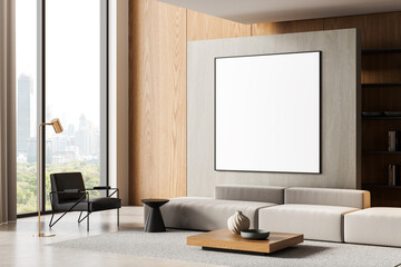 Modern living room interior with large framed empty poster mockup on concrete wall, minimalist furniture and city view through window panel. 3D Rendering