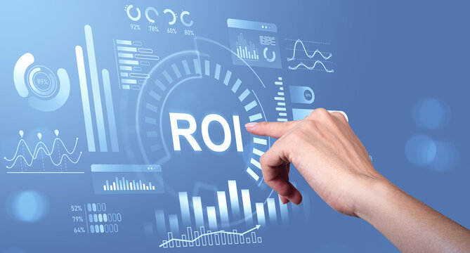 Hand pointing at ROI interface with digital charts and graphs on blue background representing business analytics and investment return concept. - Powered by Adobe