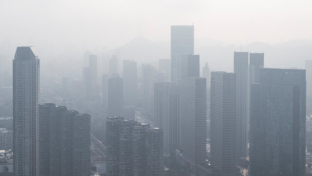 modern city buildings and downtown area in morning mist - Powered by Adobe