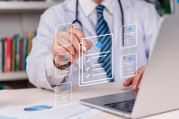 Doctor is managing patient data in a digital system, using AI technology in healthcare and...