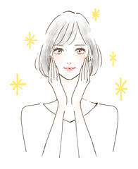 頬に手を当てる女性　笑顔の美魔女　キラキラ