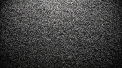 Fototapeta premium Dark gray carpet texture with a slightly shining surface. Use as a background for minimalist, modern or industrial designs.