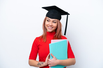 Young student Russian girl isolated on white background looking to the side and smiling