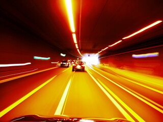 Car is driving down a highway with a yellow line on the road