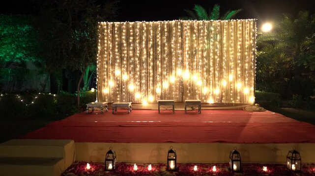 Indian Wedding Stage Decorated for Pooja Ritual with Fairy Lights Backdrop