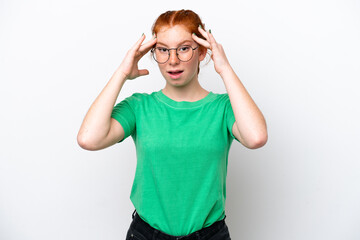 Young reddish woman isolated on white background with surprise expression