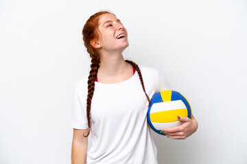 Young caucasian reddish woman playing volleyball isolated on white background laughing