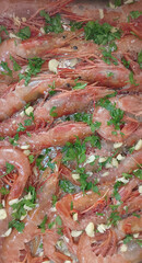 Vertical shot. Prawns, zenithal view ready to put in the oven.
