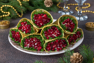 Appetizer from pita bread with crab sticks, corn and pomegranate