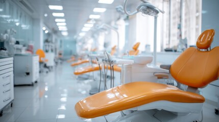 a modern dental practice with a bright and clean aesthetic. a row of identical orange dental chairs is arranged in a neat line along one wall