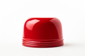 Fototapeta premium Studio shot of a red plastic container lid, showcasing its glossy finish and grooved edge