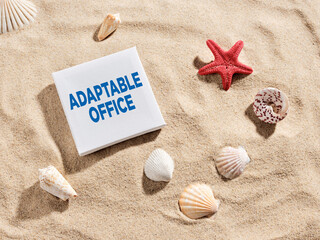 Adaptable office concept with seashells on sand at the beach