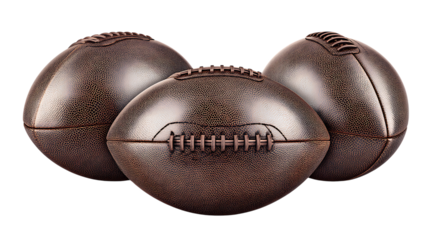 Three brown leather american footballs arranged in a group isolated on white or transparent png in studio lighting.