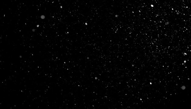 Snowflakes falling on black background