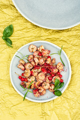 Grilled shrimps or prawns served with berry.