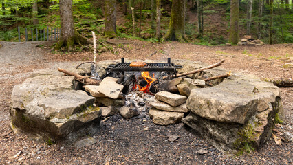 A barbeucue with saussages in mountains in Switzerland on july 20th 2025