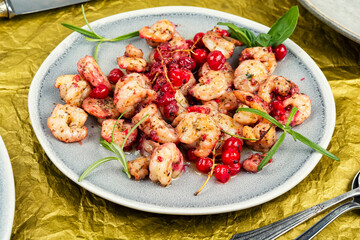 Fried shrimps with berry marinade.