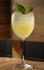 Refreshing Cocktail with Green Leaf Garnish